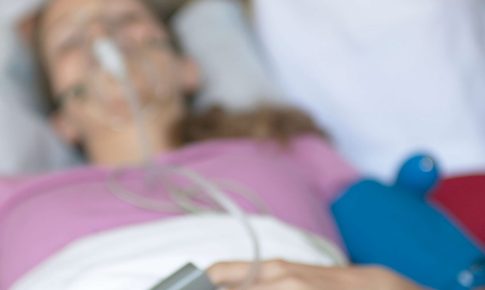 Paramedics caring for a patient